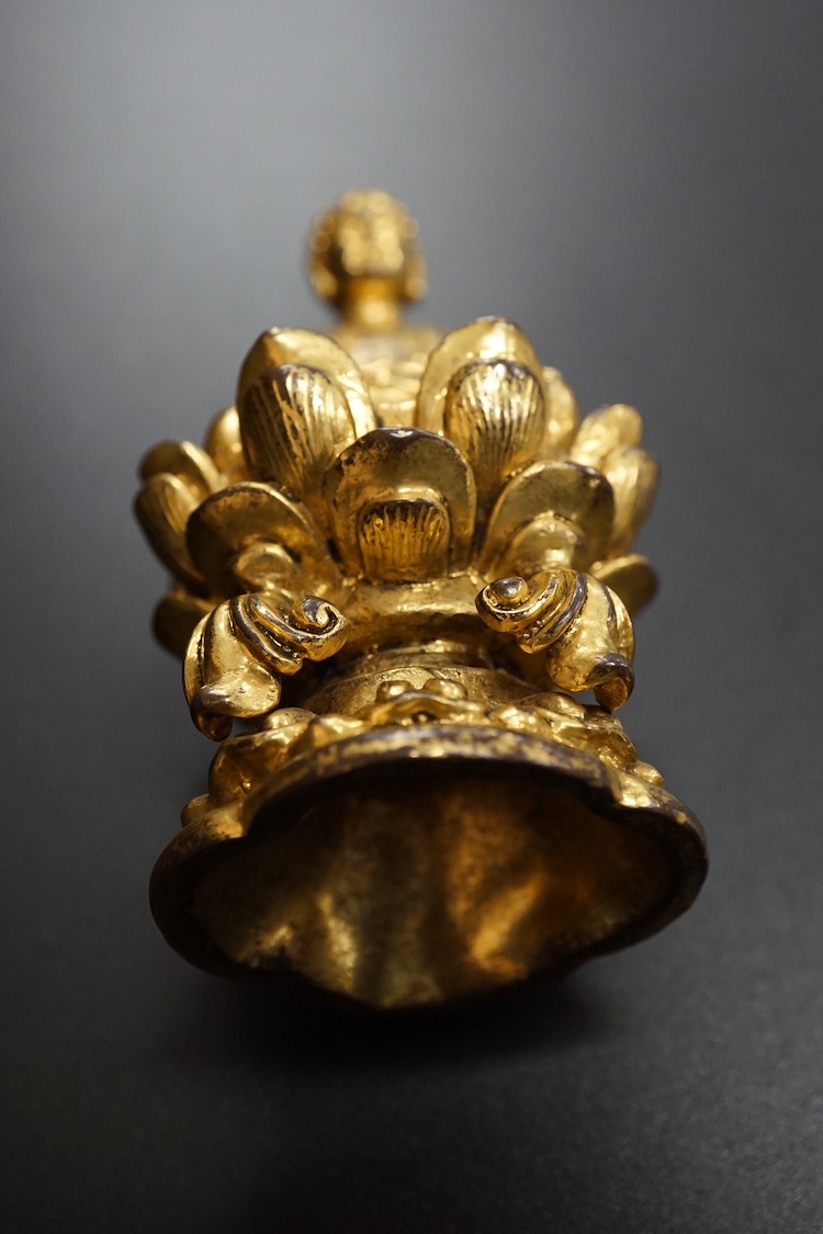 A Chinese miniature gilt metal figure of seated Buddha, 8cm high